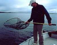 When moving in the boat with a large net, hold excess netting to avoid snagging the mesh